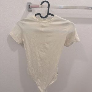 Skims body suit in color bone